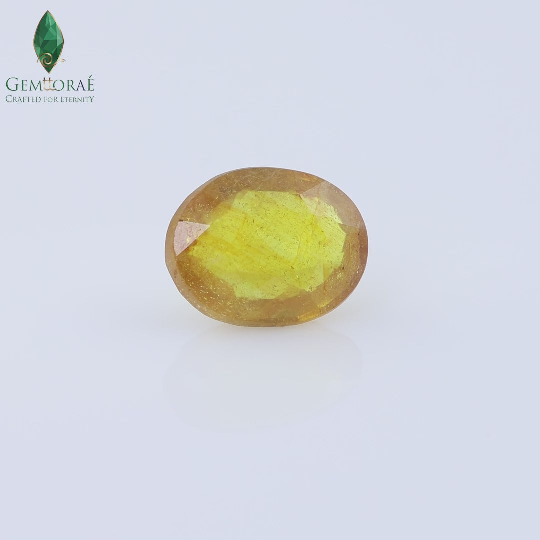 Video of natural Bangkok Yellow Sapphire rotating under light