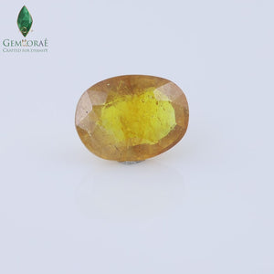 Glass filled yellow sapphire with warm golden brilliance