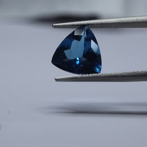 Triangular blue topaz stone with exceptional luster